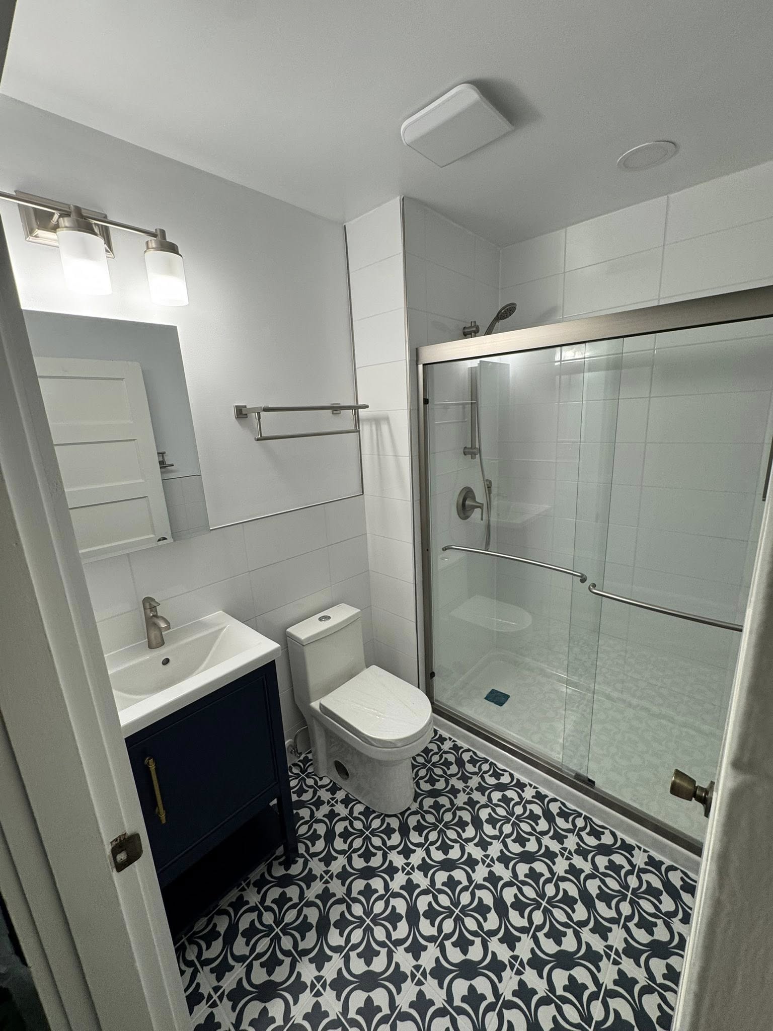 Bathroom remodeling Warrenton VA navy vanity pattern tile by Berry Good Builders