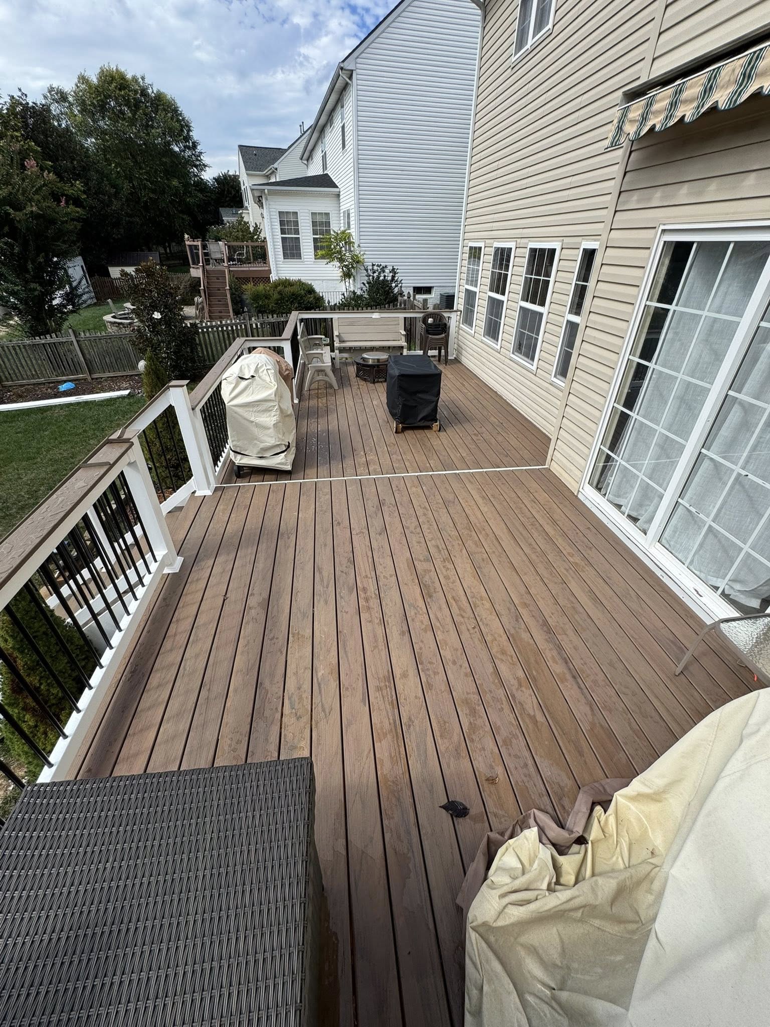 Deck builder Warrenton VA composite deck with white railing by Berry Good Builders