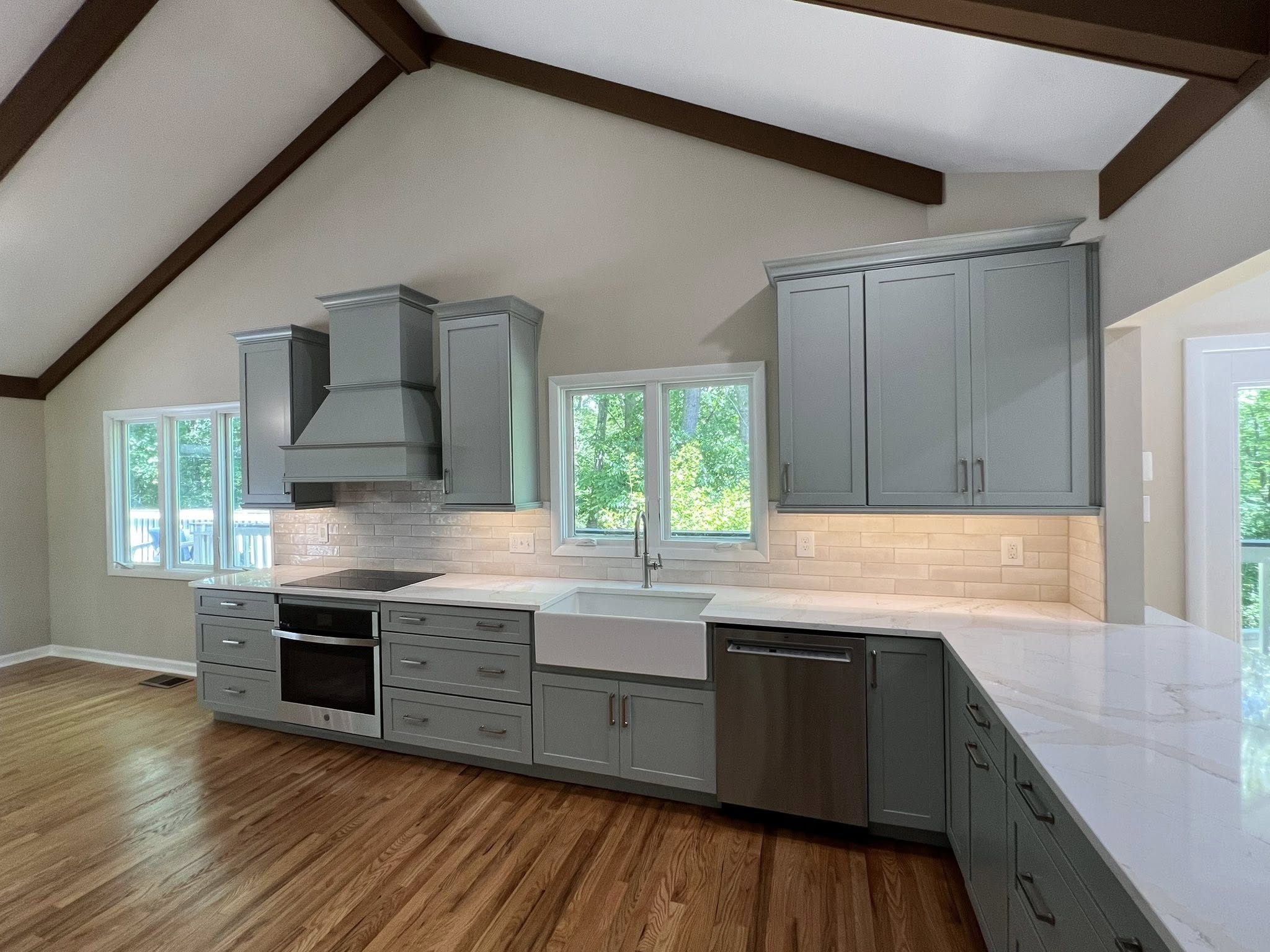 Kitchen after remodeling Warrenton VA farmhouse sink range hood Berry Good Builders