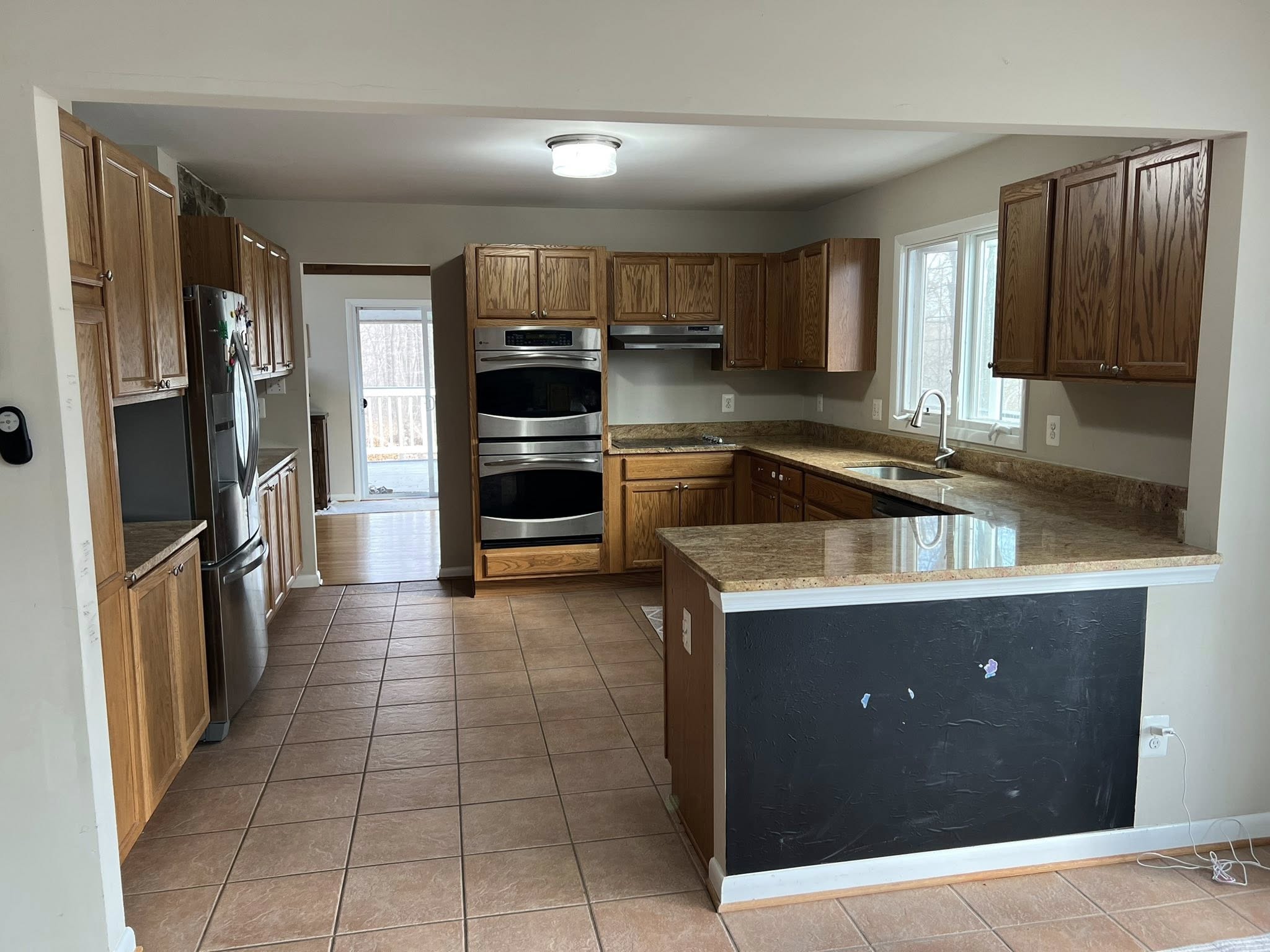 Kitchen before remodeling Warrenton VA outdated oak cabinets tile floor